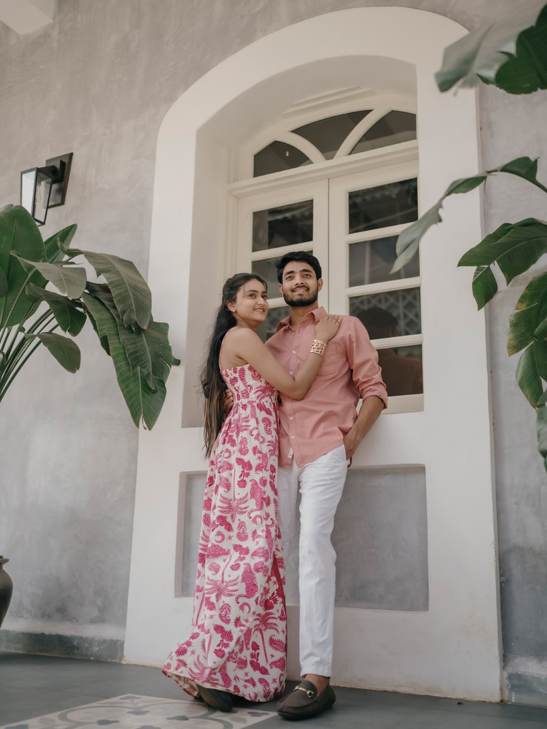 Wedding couple under floral arch
